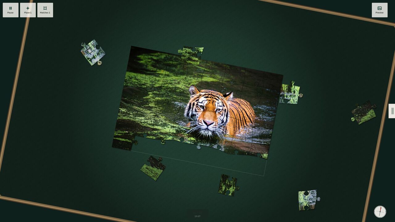 A nearly finished tiger puzzle on a rotated table